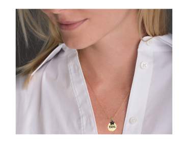 Golden engraved mama pendant with black cubic zirconia star worn around the neck