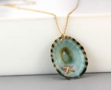 Ocean necklace gold. Tiny starfish in real limpet shell. 18k over sterling