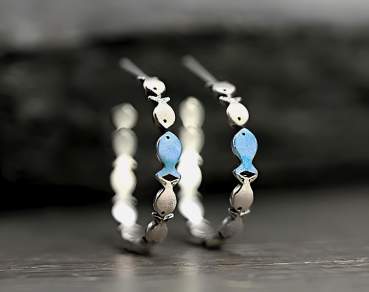 Swimming against the current. Dainty hoop earrings with blue fish