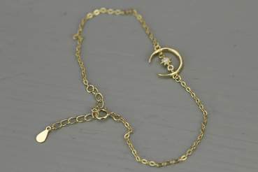 Dainty crescent moon bracelet with tiny crystal star. Sterling 18k gold plated.