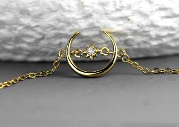 Dainty crescent moon bracelet with tiny crystal star. Sterling 18k gold plated.