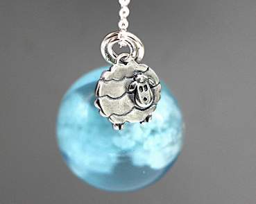 Counting sheep. Fleecy clouds in resin. Sterling silver sheep and long necklace.