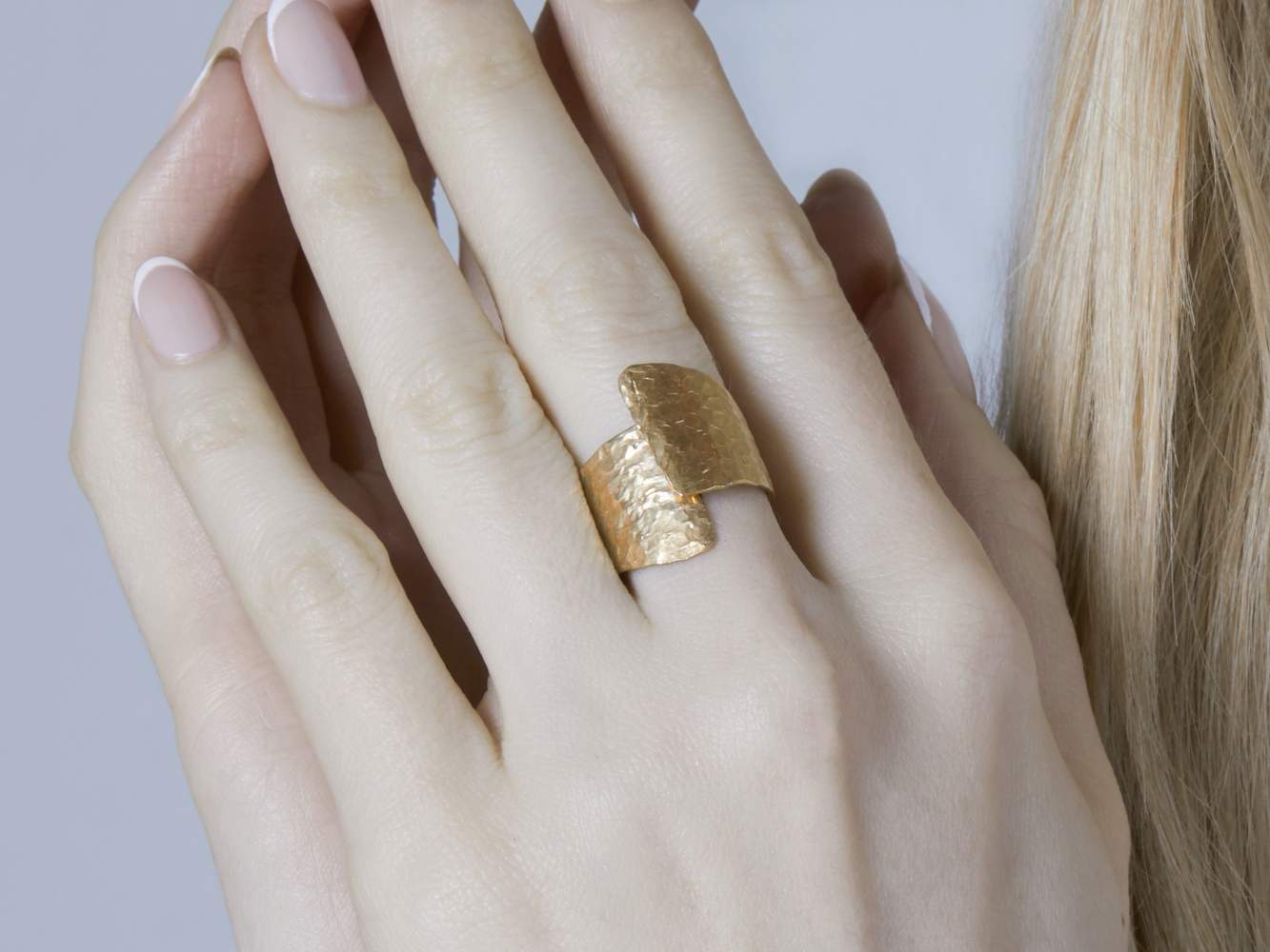 Crumpled Chunky gold ring on finger