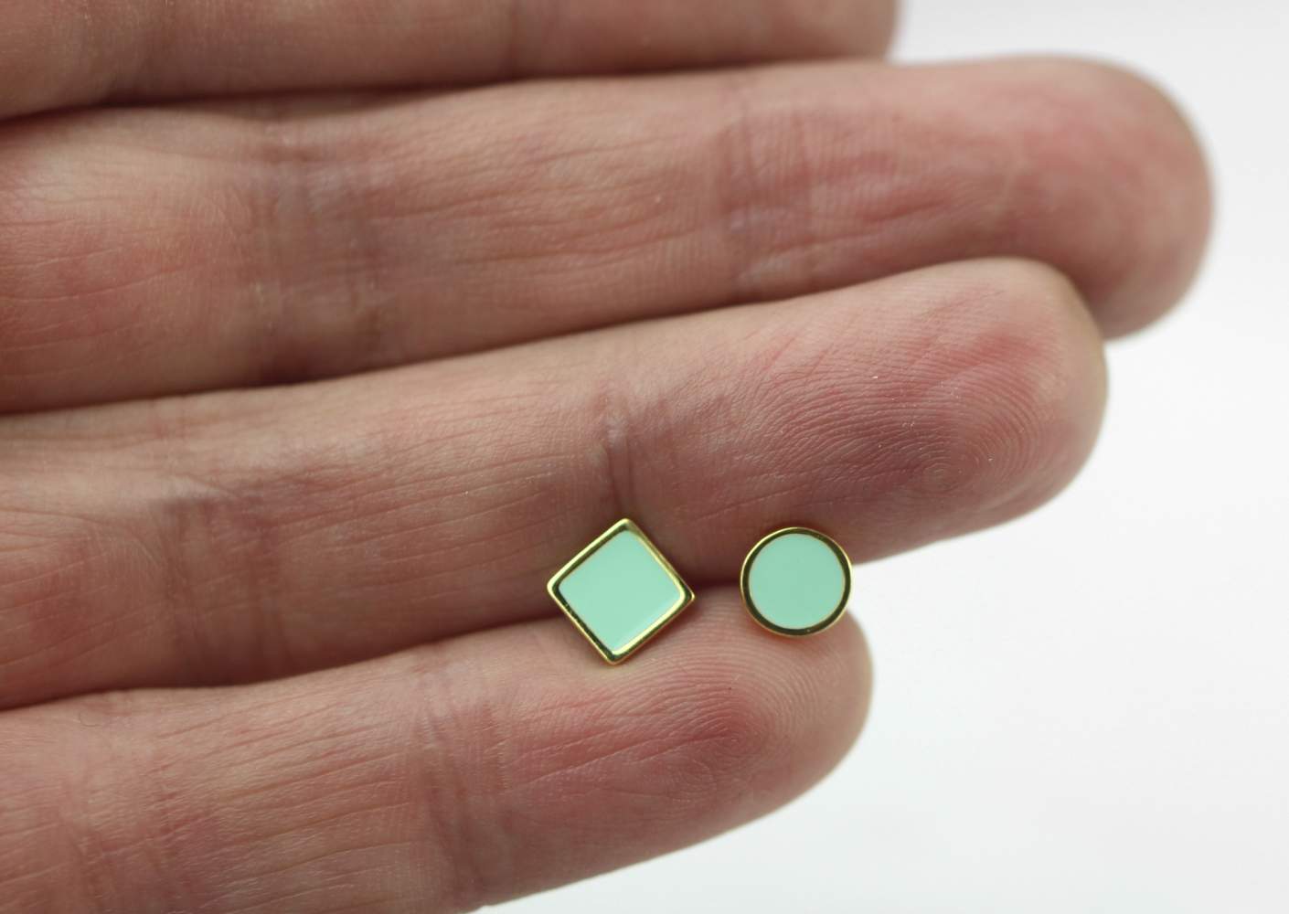 Mismatched stud earrings. 18k gold over sterling and enamel.