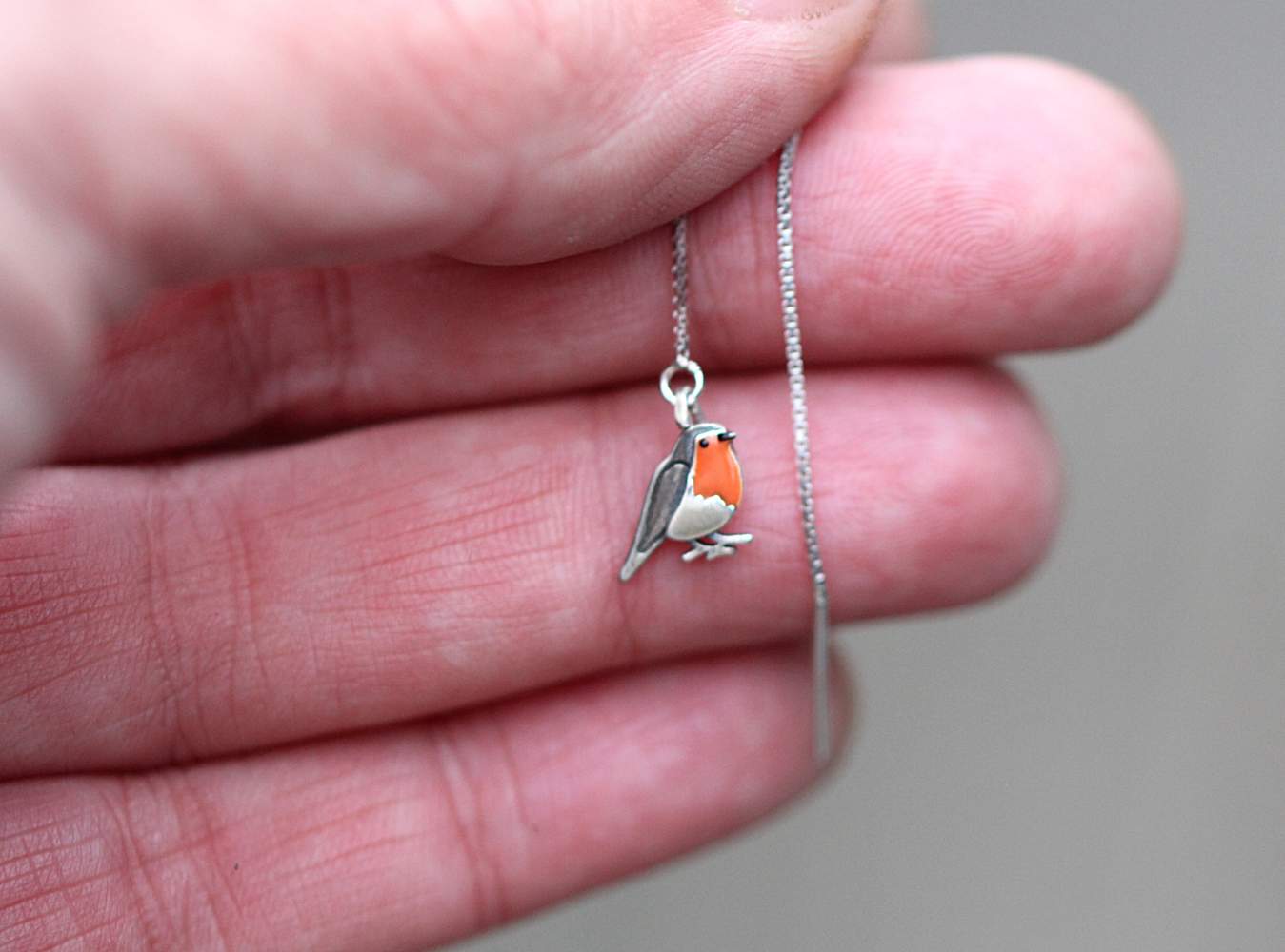 Red Robin bird threader earrings. Sterling silver and orange enamel