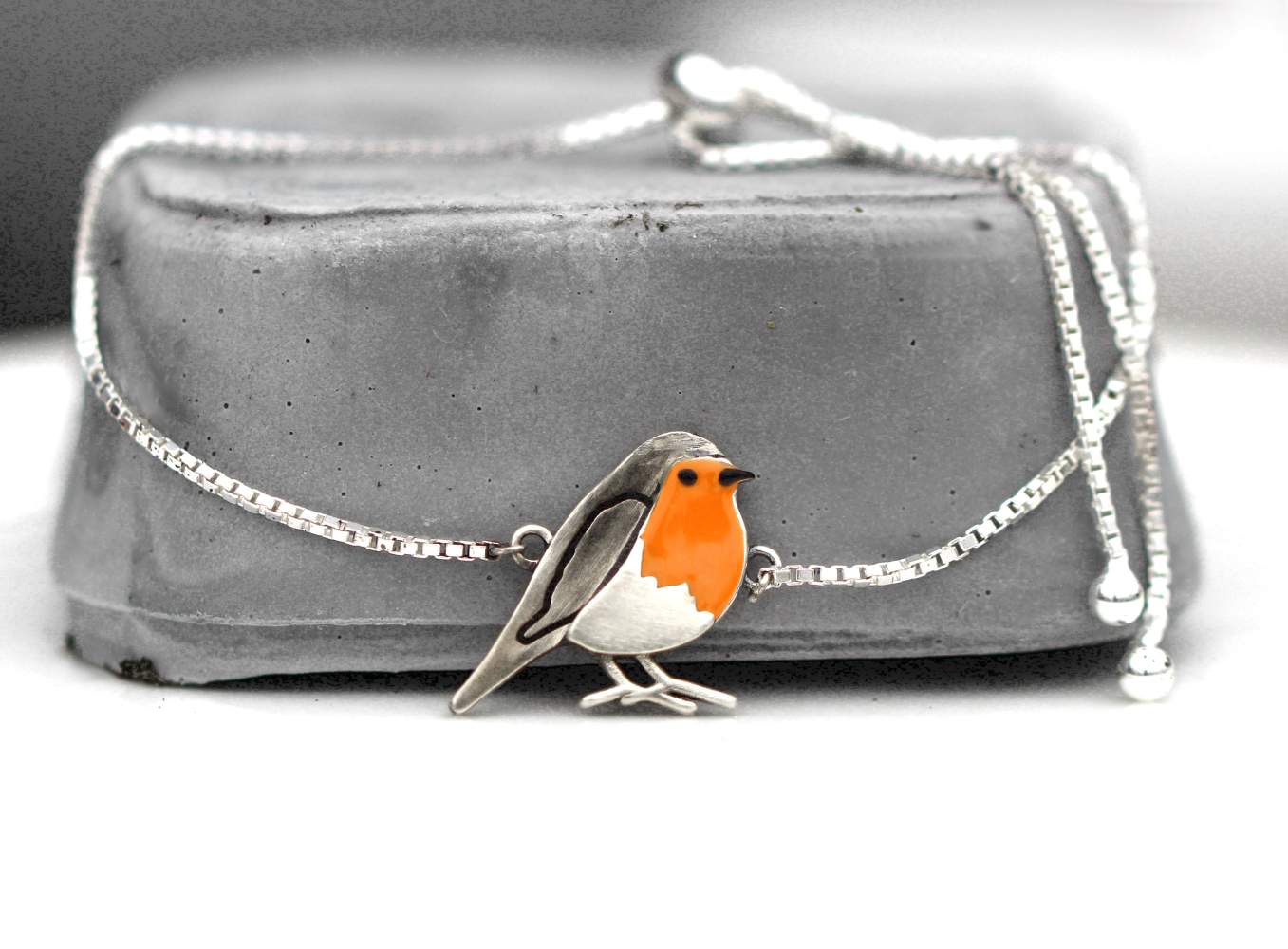 Red robin bird slider bracelet. Sterling Silver and orange enamel
