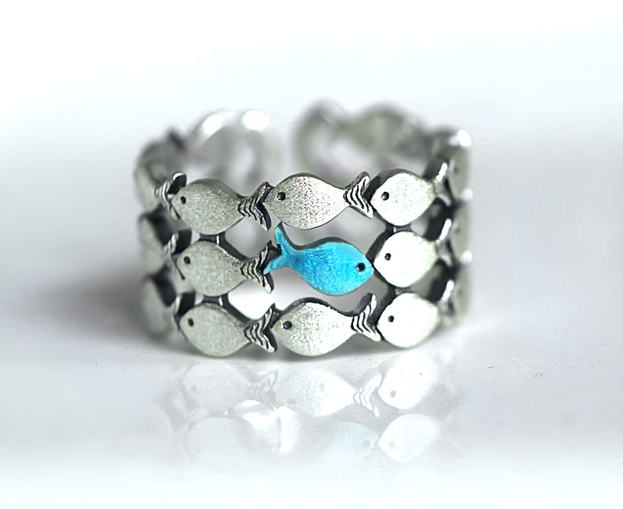 Against The Current. 925 Sterling Silver. Blue fish swimming against the tide
