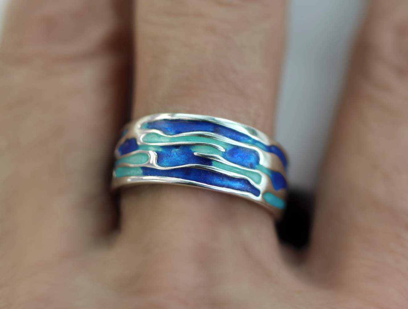 Ocean Ring. Sterling Silver ring with embedded waves and blue turquoise enamel. Adjustable.