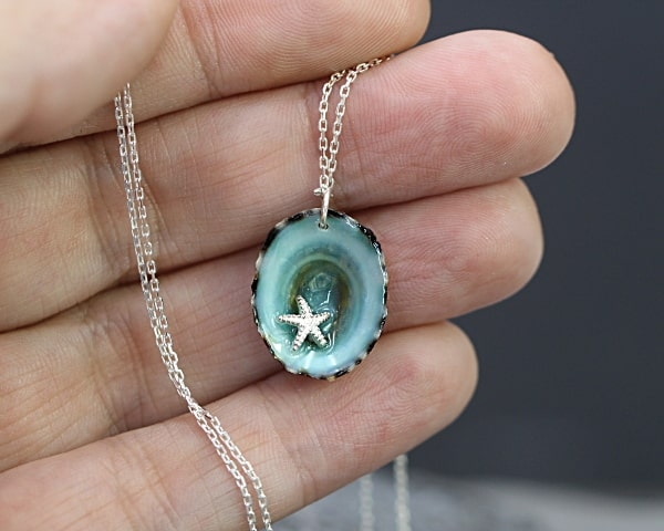Ocean necklace. Tiny starfish in real limpet shell